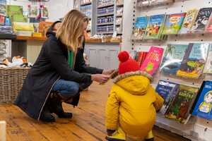 a mother and child at the gift shop in abbotsbury swannery